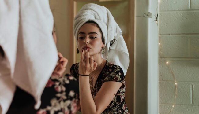 Woman applying make up